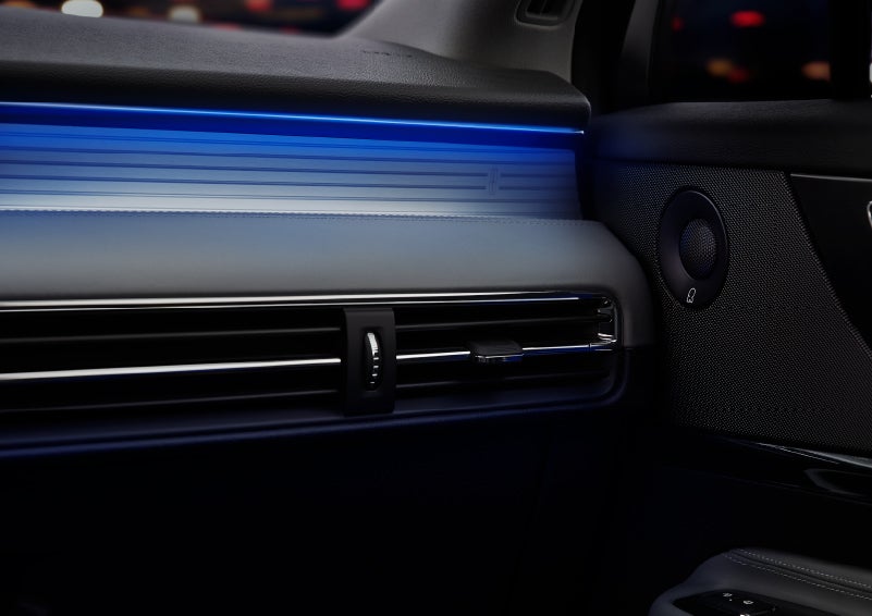 A thin available ambient blue lighting illuminates the pinstripe aluminum under an ebony dashboard, emitting a cool energy | Sentry Lincoln in Medford MA