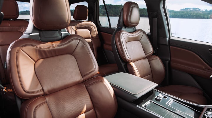The front row's Perfect Position Seats in a 2024 Lincoln Aviator® Reserve model with Ebony Roast interior | Sentry Lincoln in Medford MA