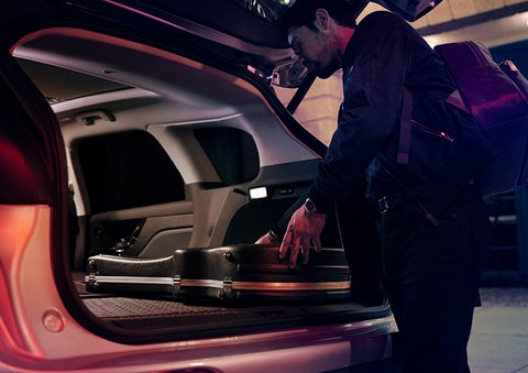 The driver of a 2024 Lincoln Corsair® SUV is shown selecting the drive mode. | Sentry Lincoln in Medford MA