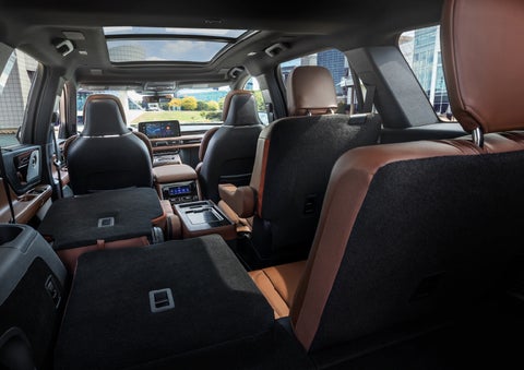 The interior of the 2025 Lincoln Aviator® SUV is shown with two seats folded down for added space. | Sentry Lincoln in Medford MA