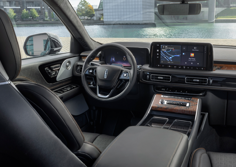 The interior of the 2025 Lincoln Aviator® SUV is shown parked with a view of a harbor through the windshield. | Sentry Lincoln in Medford MA