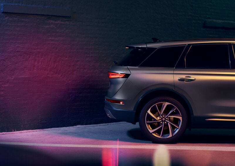 A dramatization of a 2025 Lincoln Corsair® SUV is shown backing up toward a wall. | Sentry Lincoln in Medford MA