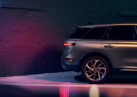 A dramatization of a 2025 Lincoln Corsair® SUV is shown backing up toward a wall. | Sentry Lincoln in Medford MA
