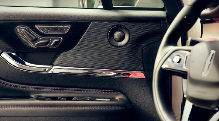 A Revel® audio speaker is shown in the driver's side door of a 2025 Lincoln Corsair® SUV. | Sentry Lincoln in Medford MA