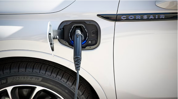 An electric charger is shown plugged into the charging port of a Lincoln Corsair® Grand Touring
model. | Sentry Lincoln in Medford MA