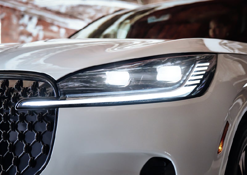 A close-up of a headlamp on the 2026 Lincoln Aviator® SUV is shown. | Sentry Lincoln in Medford MA