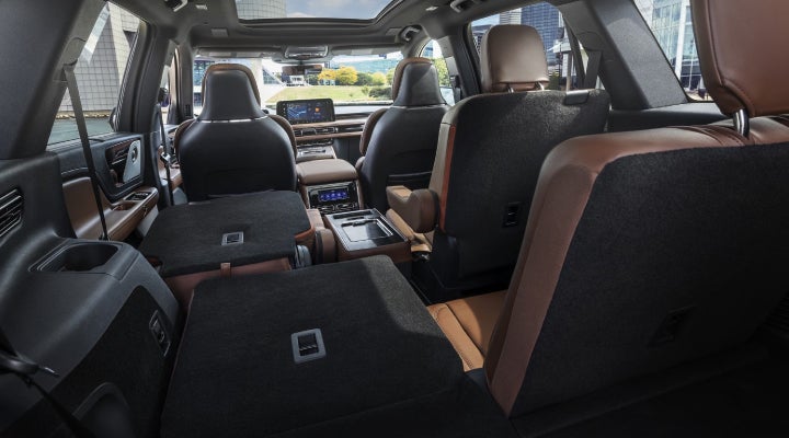 One side of the PowerFold® third-row seat and a second-row seat are folded forward in the 2026 Lincoln Aviator® SUV. | Sentry Lincoln in Medford MA
