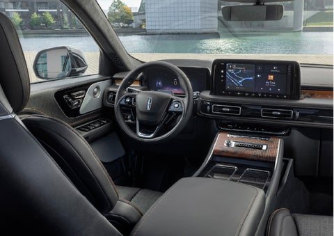 The interior of the 2026 Lincoln Aviator® SUV is shown parked with a view of a harbor through the windshield. | Sentry Lincoln in Medford MA