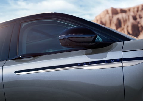 Blue lettering on the side of the vehicle that reads Nautilus indicates the available Hybrid Powertrain. | Sentry Lincoln in Medford MA