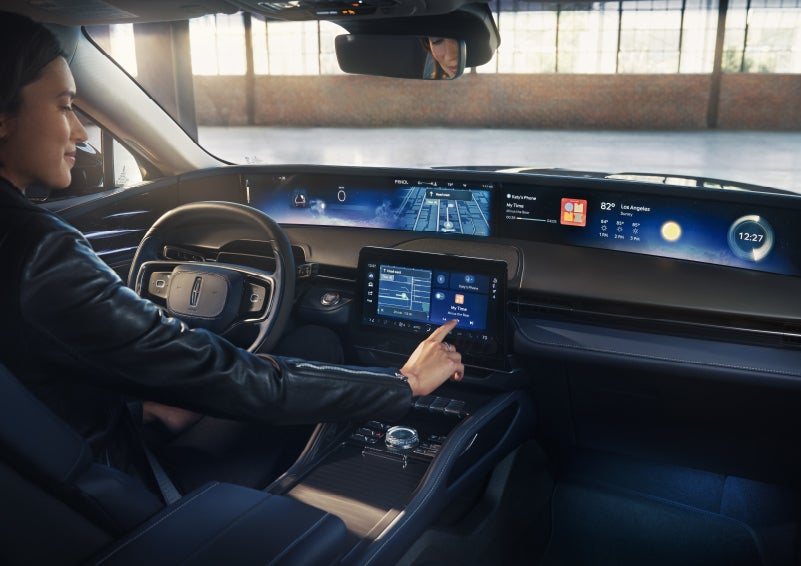 The driver of a 2026 Lincoln Nautilus® SUV interacts with the center touchscreen. | Sentry Lincoln in Medford MA