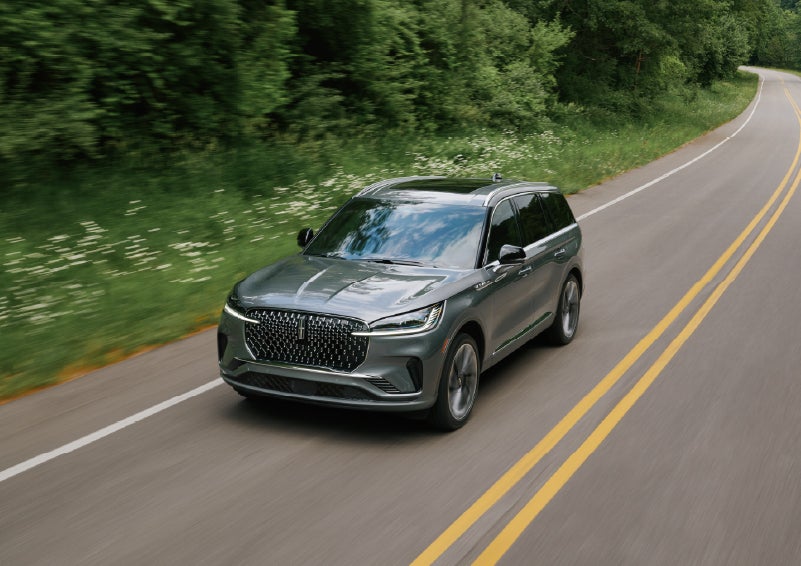 A 2027 Lincoln Aviator® SUV is being driven down a road. | Sentry Lincoln in Medford MA