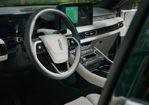 The leather-trimmed steering wheel of a 2027 Lincoln Aviator® Black Label™ SUV. | Sentry Lincoln in Medford MA
