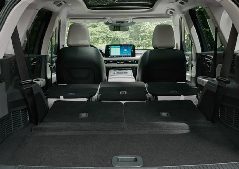 A rear to front view of the interior of a 2027 Lincoln Aviator® Black Label™ SUV shows the third and second rows folded flat | Sentry Lincoln in Medford MA
